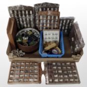 A quantity of thimble display racks containing porcelain thimbles.