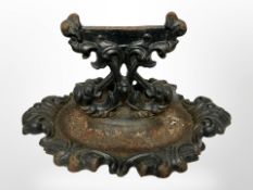 A 19th-century cast-iron boot scraper, width 35cm.
