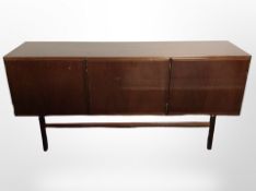 A Danish stained teak triple-door low sideboard, 180cm wide x 50cm deep x 82cm high.