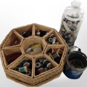 An octagonal wicker sewing box containing a quantity of threads, buttons, etc.
