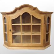 A Danish blonde oak glazed wall cabinet, width 84cm.