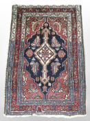 An Iranian rug, 86cm x 59cm.