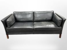 A 20th-century Danish black leather three-seater settee, length 188cm x depth 78cm x height 66cm.