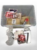 A quantity of new stock including cake tins, packs of adhesive, facial massagers, etc.