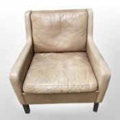 A Danish tan leather armchair.