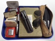 A group of lighters including Ronson and Zippo, together with a pair of sunglasses, Parker pens,