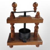 A fruit press, height 35cm.