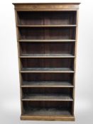 An early-20th century continental mahogany and pine open bookcase,