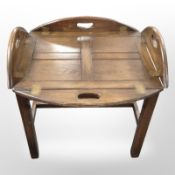 An oak butler's tray table, width 67cm.