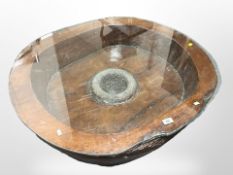 A rustic burr wood coffee table with plate glass top, width 94cm.