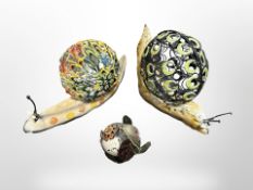 Two contemporary wrought-metal snail ornaments, tallest 27cm,