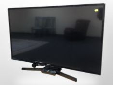 A Panasonic 43-inch LCD TV, with lead and remote.