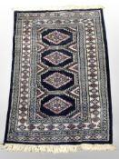 A Lahore Bokhara rug, Pakistan, 103cm x 68cm.