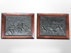 A pair of Dutch cast-iron relief plaques depicting interior scenes, in mahogany frames, width 24cm.