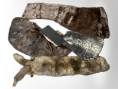 A group of fur stoles.