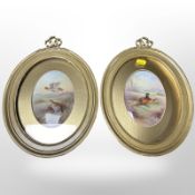 A pair of Paragon hand-painted oval porcelain plaques by F Nicklewright depicting game birds,