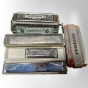 A collection of mouth organs including Hohner.