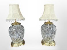 A pair of Waterford crystal brass-mounted table lamps with tasselled shades, height 48cm.