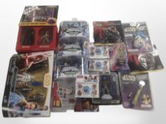 Approximately 16 Hasbro and other Star Wars figurines and related collectibles, boxed.