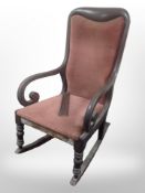 A 19th-century mahogany scroll-arm rocking chair (as found).