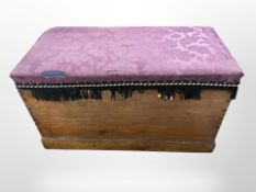 An early-20th century upholstered pine blanket chest, 103cm wide x 54cm deep x 60cm high.