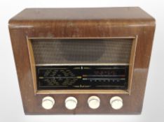 A mid-20th century Bush walnut-cased valve radio, width 41cm.