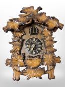 A Kaiser cuckoo clock with quartz movement, height 30cm.