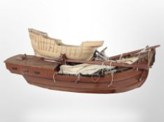 A scale model galleon on stand, plus a further galleon hull, largest 100cm long.