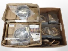 A quantity of new pendant light hangers.