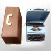 A Boots typewriter and a sewing machine, in case.