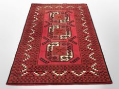 A machine-made Turkoman design rug,