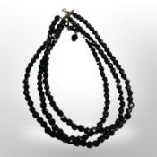 A faceted jet necklace.