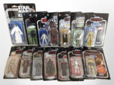 14 Kenner Star Wars figurines including The Mandalorian, The Empire Strikes Back, The Force Awakens,