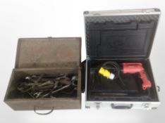 A Site drill in box, and a further metal tool box containing spanners and other hand tools.