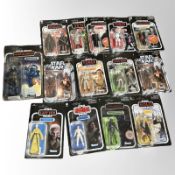 14 Kenner Star Wars figurines including The Mandalorian, The Empire Strikes Back, The Force Awakens,