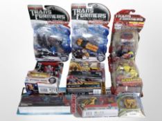 10 Hasbro Transformers figurines, boxed.