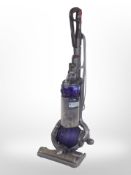 A Dyson DC25 upright vacuum cleaner.