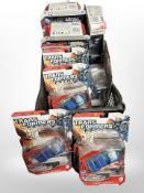 12 Hasbro Transformers figurines, boxed.