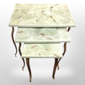 A nest of three gilt metal tables with faux marble top, width 60cm.