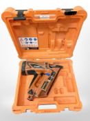 A Paslode Impulse IM 360 Ci nail gun in case