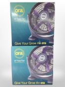 Two Ora 14-inch floor fans, in boxes.
