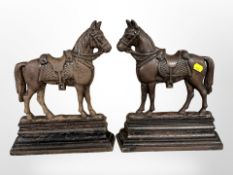 A pair of cast-iron horse door stops, height 30cm.