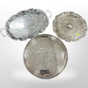 Three silver-plated serving trays, largest 55cm wide.