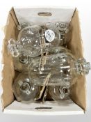 Eight modern glass demijohns.