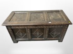 A George III carved panelled-oak coffer,