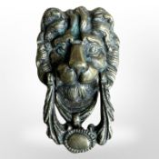 A Victorian brass lion mask door knocker, length 18cm.
