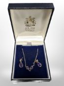 A 9ct gold amethyst pendant, together with a similar pair of earrings.