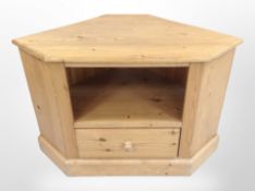 A contemporary pine corner entertainment stand, width 91cm.
