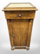 A 19th-century continental walnut and birdseye maple pedestal cabinet with marble-inset top,