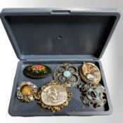 A group of six brooches including a Victorian Pinchbeck cameo brooch depicting a classical scene,